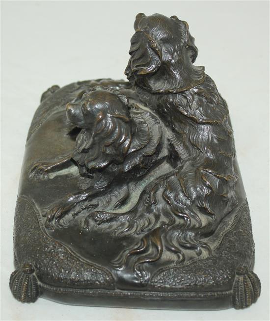 A late 19th / early 20th century patinated bronze group modelled as two spaniels, 8.5in.